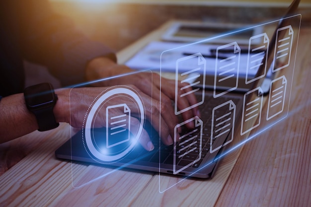 Photo document management concept businessman using computer to document management concept online documentation database and digital file storage system or software records keeping database technology