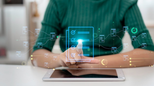 Photo document planning and digital form checklist by laptop computer with a document management checking system online documentation database and process management files on a big data network