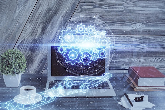 Photo double exposure of desktop computer and technology theme hologram concept of software development