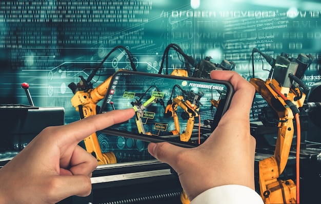 Photo engineer controls robotic arms by augmented reality industry technology