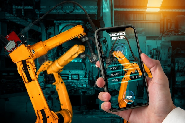 Photo engineer controls robotic arms by augmented reality industry technology