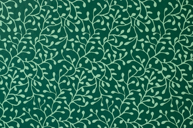 Photo green background with a pattern of tree branches