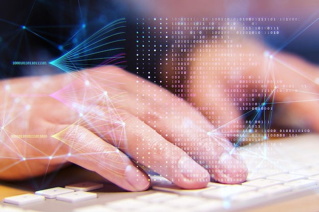 Photo a hand typing on a keyboard with digital network and binary code overlay symbolizing technology and data processing on a bokeh background