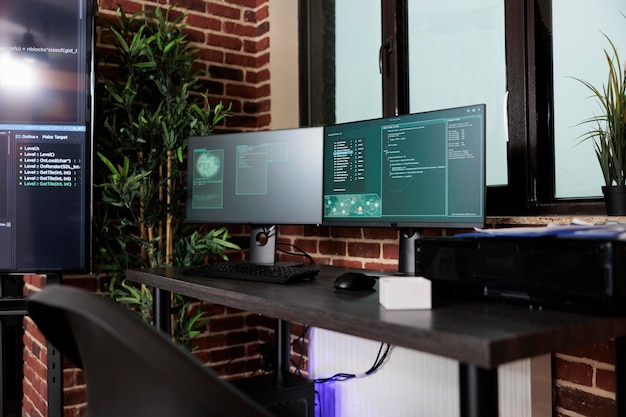 Photo image of two computer screens displaying software data information and integrated algorithms. multiple display cyber security setup computing artificial intelligence communication program.