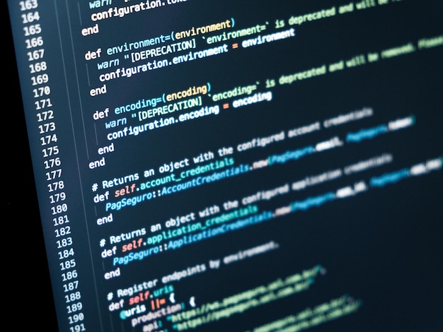 Photo information technology concept coding script text on screen programming code abstract screen