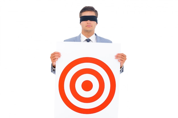 Photo man with blindfolded and a target