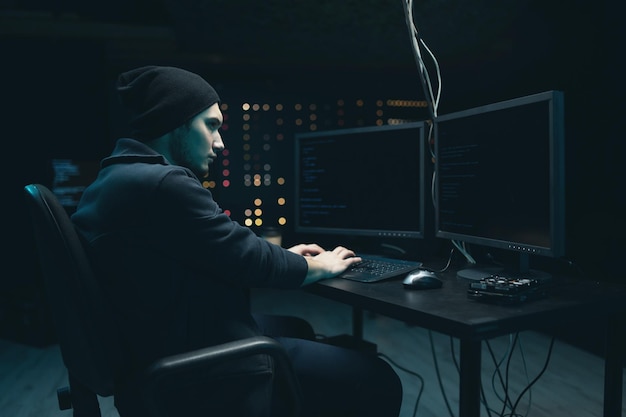 Photo middle aged hacker making cryptocurrency fraud using virus software and computer interface