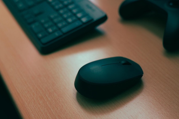 Photo mouse keyboard video game controller complements of a computer on a desk
