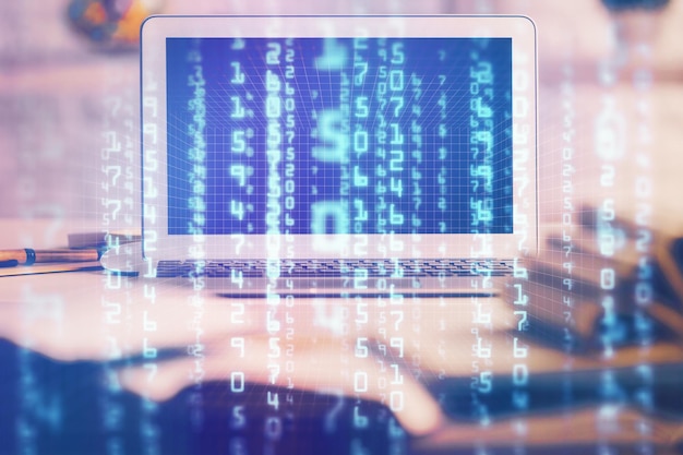 Photo multi exposure of desktop computer and technology theme hologram concept of software development