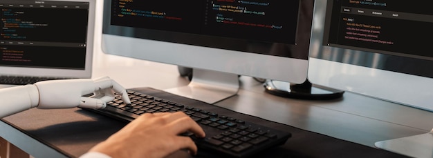 Photo program coding automation by generative artificial intelligence or ai concept collaboration between robotic hand and human software developer solving debugging or writing scripttrailblazing