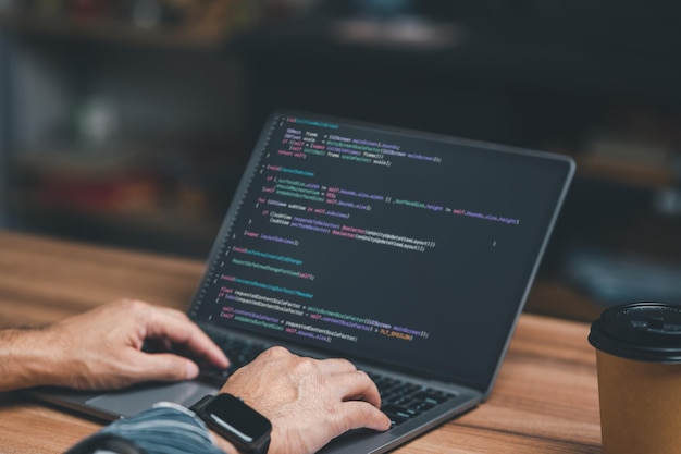 Photo programmer coding compiler encode debug and developer application software for business corporate with laptop computer man programming coding web app from work at home code show screen monitor