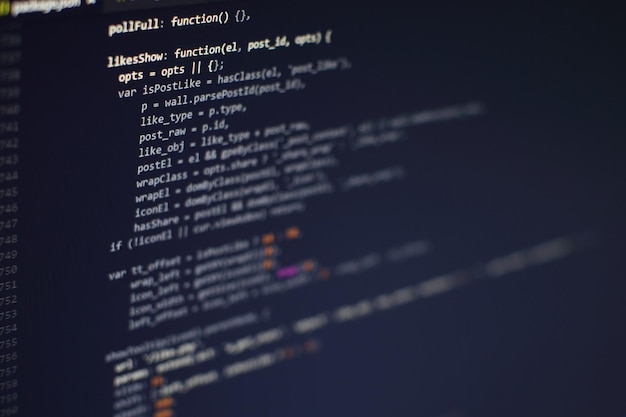 Photo programming code on computer screen. software development. writing program code on computer.
