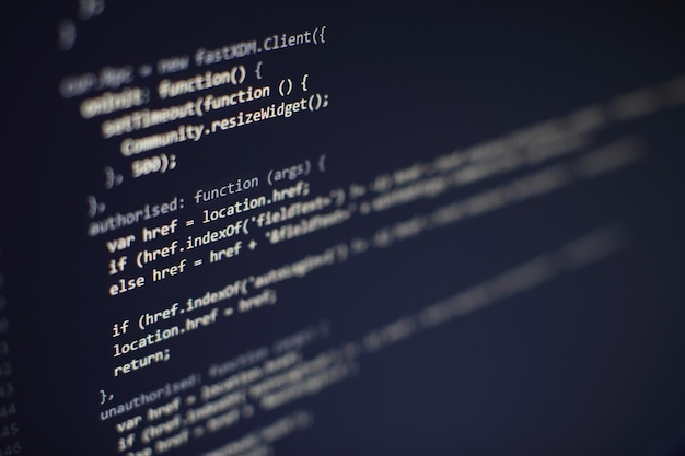 Photo programming code on computer screen. software development. writing program code on computer.