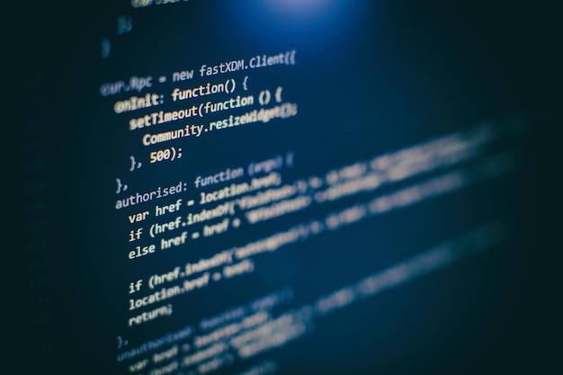 Photo programming code on computer screen. software development. writing program code on computer.