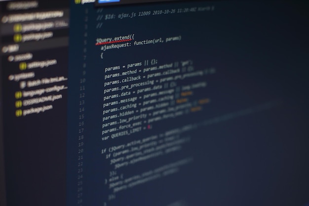 Photo programming code on computer screen. software development. writing program code on computer.