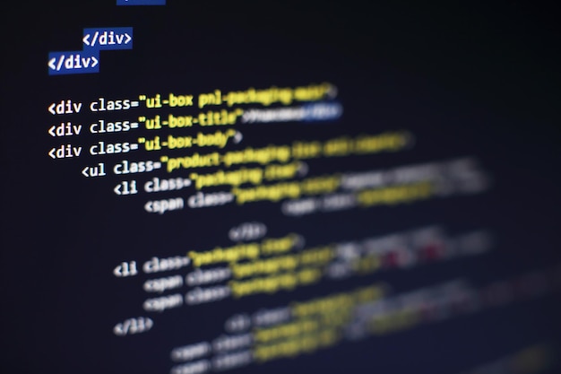 Photo programming code on computer screen. software development. writing program code on computer.