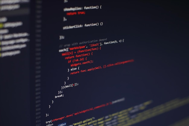 Photo programming code on computer screen. software development. writing program code on computer.