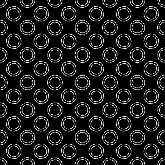 Photo repeating white circles pattern on black background