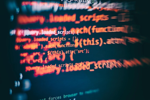 Photo running computer data / www programming. coding script text on screen. notebook closeup photo.