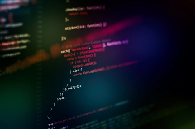 Photo running computer data / www programming. coding script text on screen. notebook closeup photo.