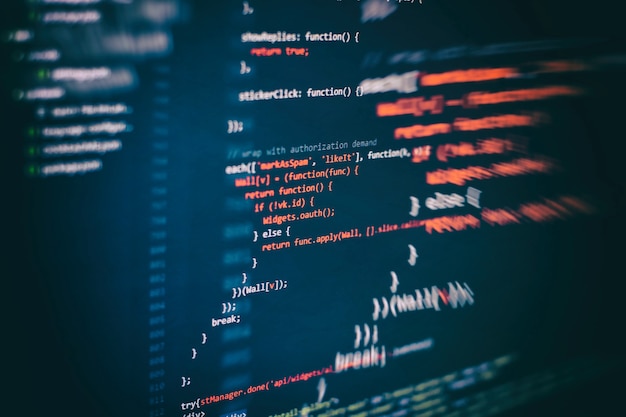 Photo running computer data / www programming. coding script text on screen. notebook closeup photo.