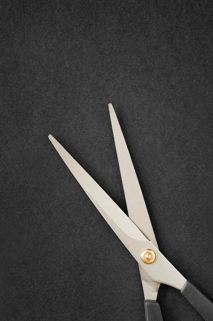 Photo scissors on black background