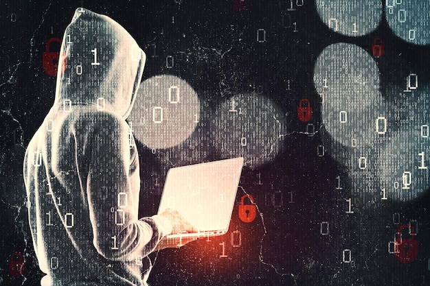 Photo side view of hacker in hoodie using laptop while standing on abstract dark hacking background with bokeh circles and binary coding malware and phishing data theft concept