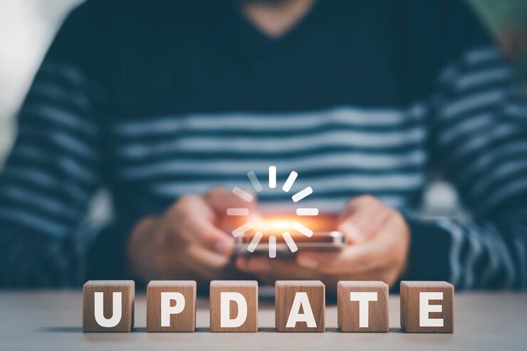 Smartphone and wooden block cube Update Software Computer Program Upgrade Business Technology Internet Update on virtual screen Internet and technology concept loading bar with installing update