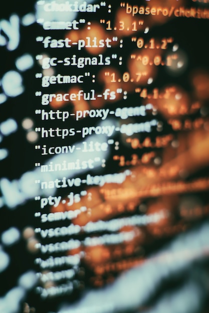 Photo software developer programming code. abstract computer script code. selective focus