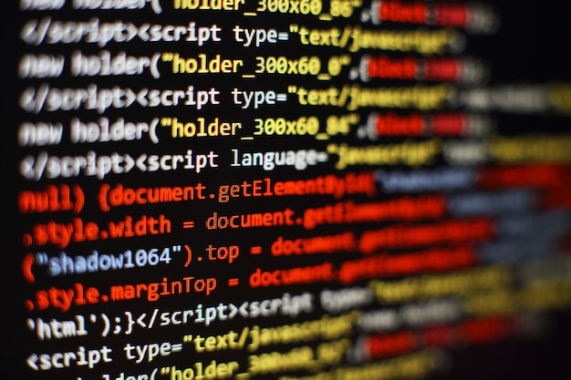 Photo software developer programming code. abstract computer script code. selective focus