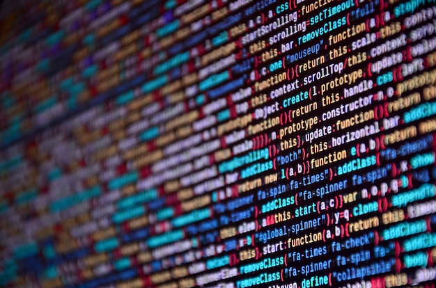 Photo software developer programming code on computer. 