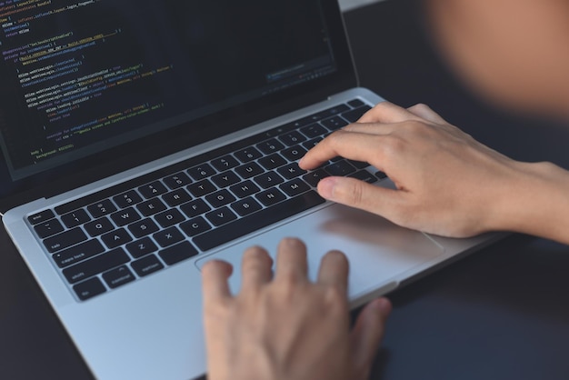 Photo software development programmer software developer coding html programming javascript on laptop computer screen