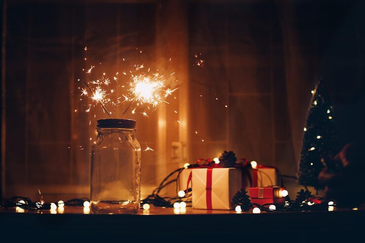 Photo sparklers in jar on table during christmas