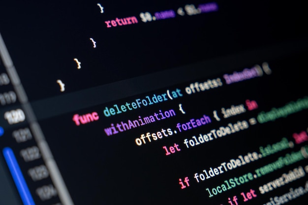 Photo swift function code on screen showing folder deletion logic with animation and loop structure