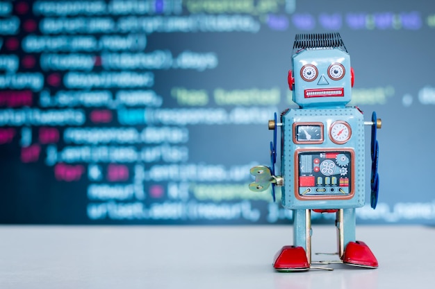 Photo symbol for a chatbot or social bot and algorithms program code in the background