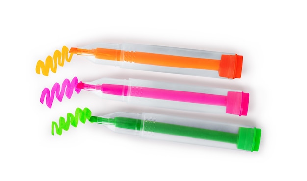 Photo three multi-colored markers on a white background