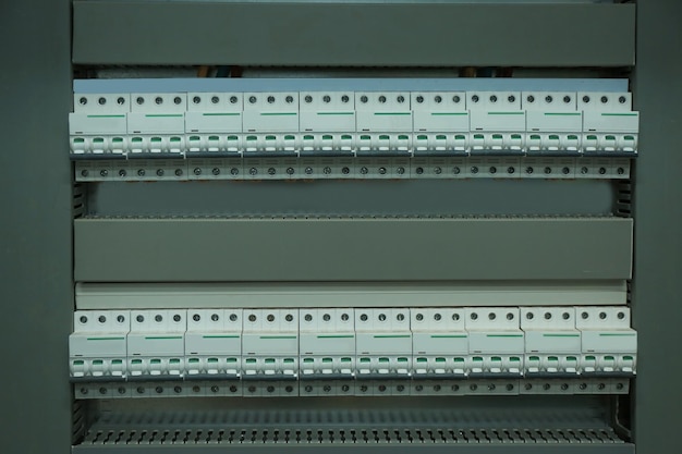 Photo view of automatic circuit breakers in distribution board closeup