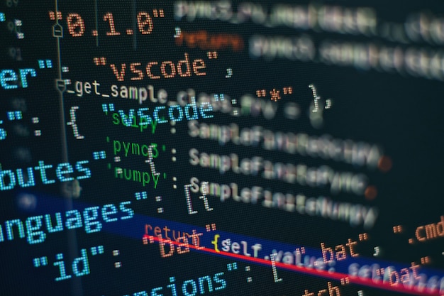 Photo website html code on the laptop display closeup photo. information technology website coding standards for web design programmer developer screen.