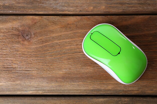 Photo wireless computer mouse on wooden background