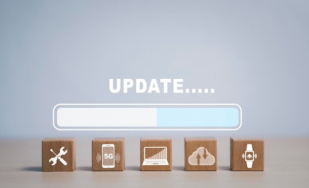 Photo wooden block cube update software computer program upgrade business technology internet update on virtual screen internet and technology concept loading bar with installing the update