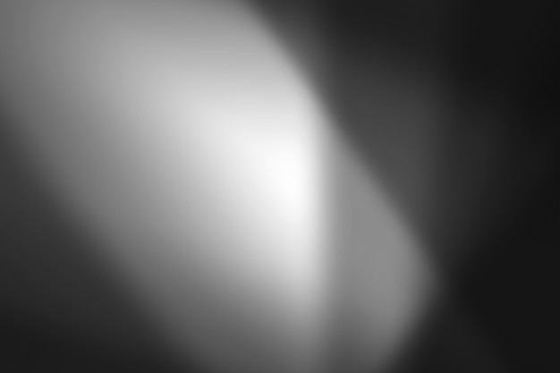 PSD bright light illuminating a dark gray backdrop creating a gradient effect with soft edges