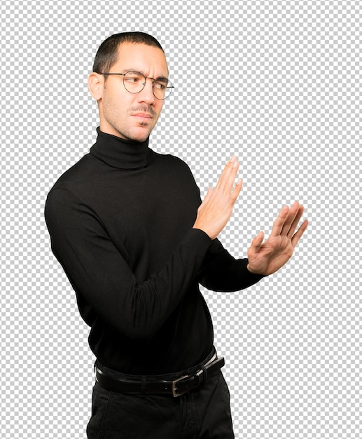 PSD doubtful young man doing a gesture of keep calm