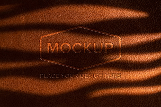 PSD dramatic warm light over leather logo mockup