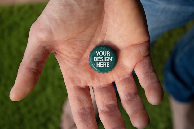 PSD hand holding cap mockup