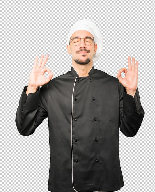 PSD happy young chef doing a gesture of meditation