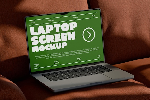 PSD laptop screen mockup on sofa