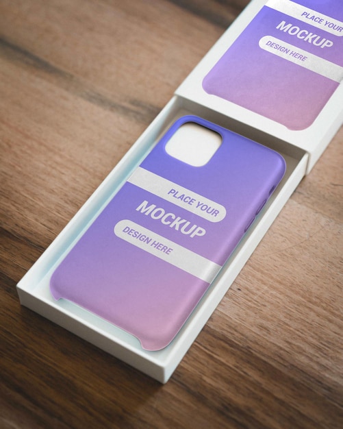 PSD realistic phone case mockup with reflection on box on wooden table