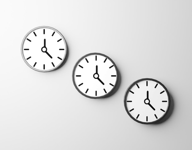 PSD three clocks showing different times on a white wall
