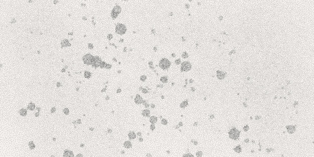 Vector black dotted textured background noisy gritty dot halftone effect vector illustration