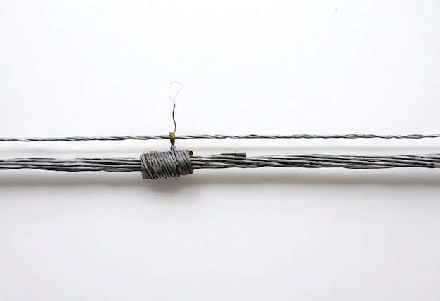 Vector a string is tied to a string that has a piece of wire attached to it